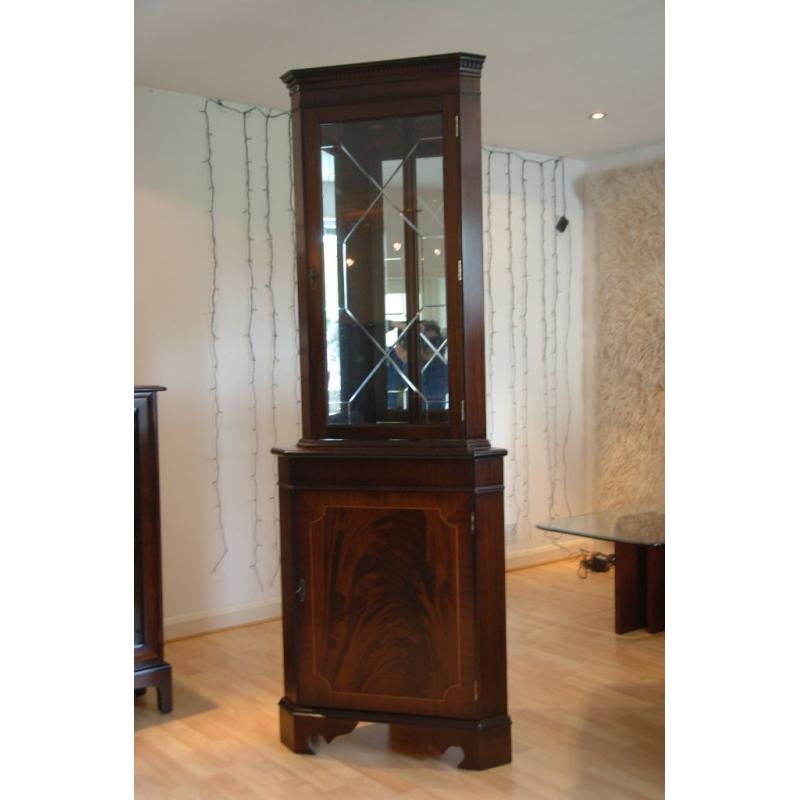 Mahogany floor standing display cabinet with built in light and matching wall mounted cabinet.