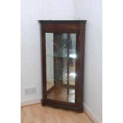 Mahogany floor standing display cabinet with built in light and matching wall mounted cabinet.