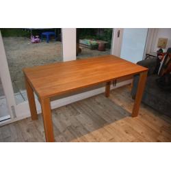 Solid wood kitchen table. Only selling as it never gets used. Couple of mug stains as shown. Seats 4