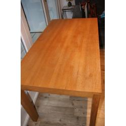 Solid wood kitchen table. Only selling as it never gets used. Couple of mug stains as shown. Seats 4