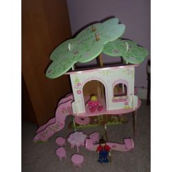 Wooden Tree House and Two Dolls