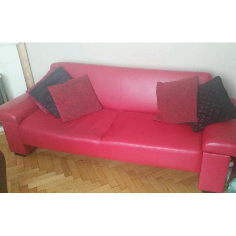 Red leather effect sofa bed