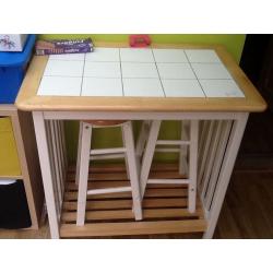 Tiled top table with two stools