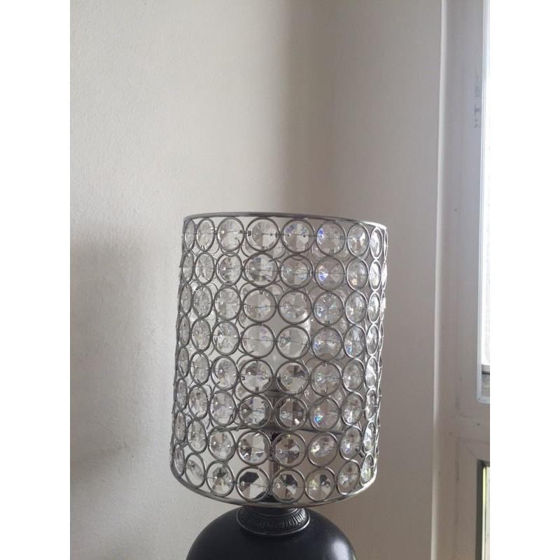 A pair of glass and stainless steel lamp shades very pretty light effect