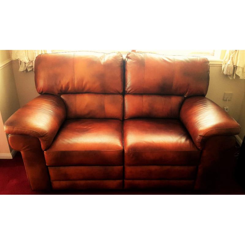 Genuine Italian luxury tan leather. 2 seater reclining sofa