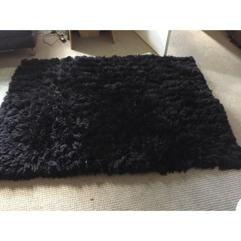 Rug- think make black long pile shaggy rug