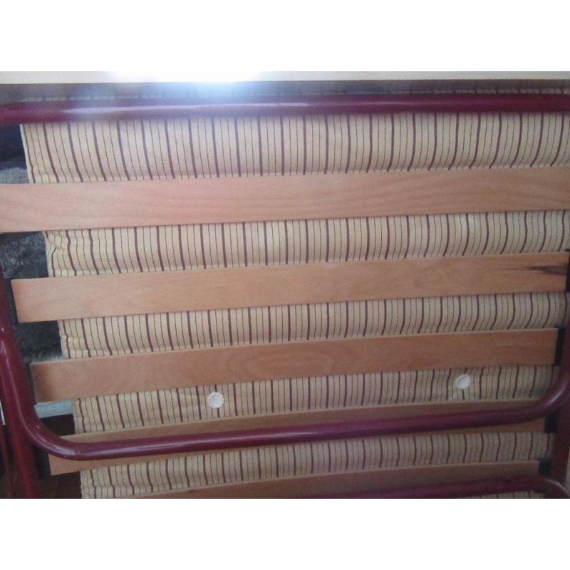 A John Lewis Burgandy and biege stripe foldaway single camp bed. In very good condition.