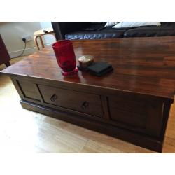 Solid coffee table with ample storage