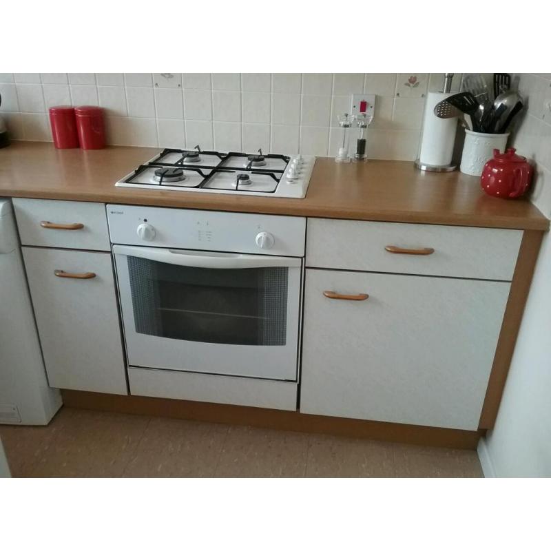 Kitchen units with hob, oven, extractor fan and white composite sink