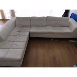 White faux leather, left hand corner couch. DWELL