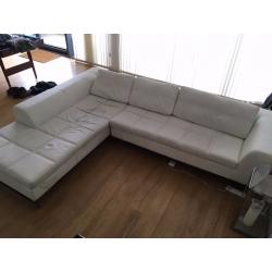 White faux leather, left hand corner couch. DWELL