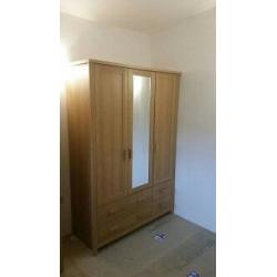 1 three door wardrobe with mirror & four draws. Not flat packed in immaculate condition. QUICK SALE