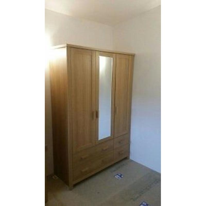 1 three door wardrobe with mirror & four draws. Not flat packed in immaculate condition. QUICK SALE