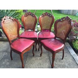 Four wooden dining chairs