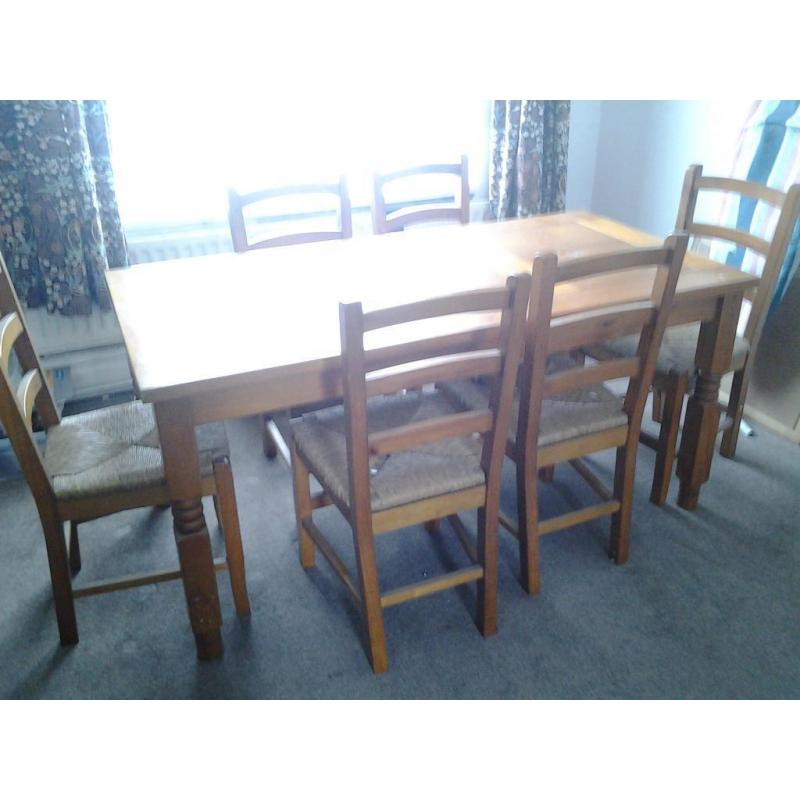 pine wood dining table and 6 matching chairs