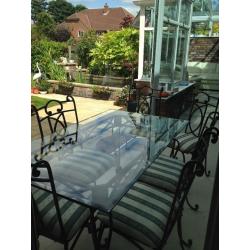 Wrought iron glass top dining table & six chairs. Excellent condition. Selling due to new extension.