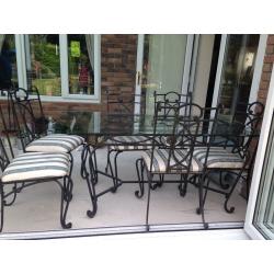 Wrought iron glass top dining table & six chairs. Excellent condition. Selling due to new extension.