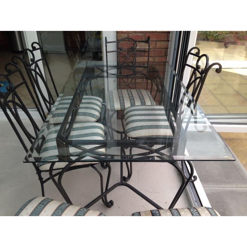 Wrought iron glass top dining table & six chairs. Excellent condition. Selling due to new extension.
