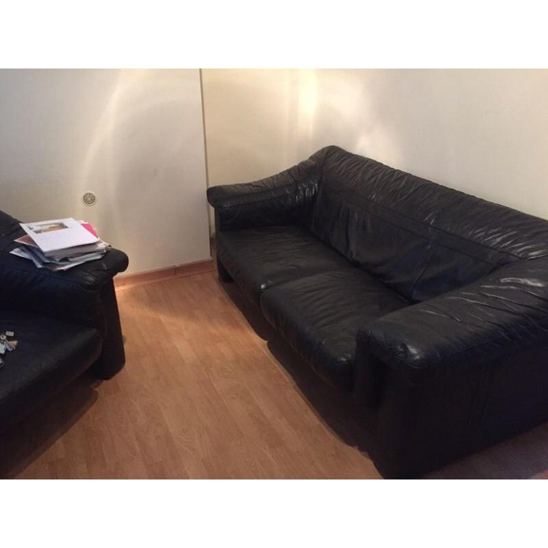 Black leather sofa and armchair