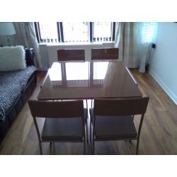 DINING ROOM TABLE AND 4 CHAIRS.