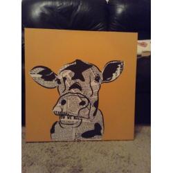 Funky newspaper print cow canvas