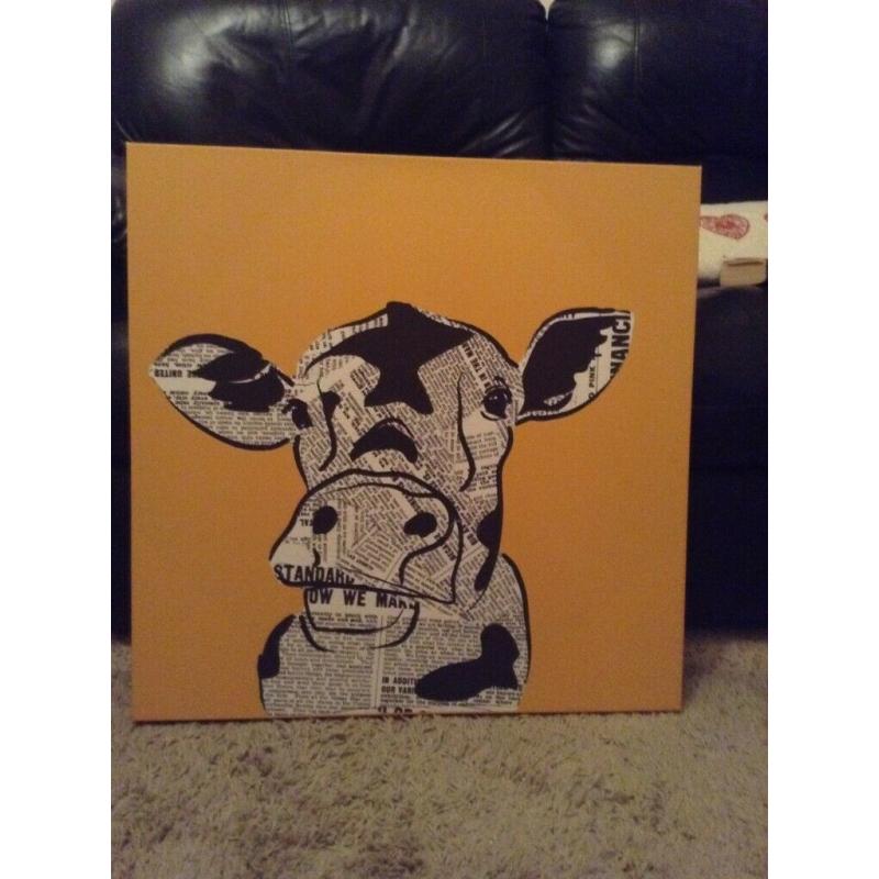 Funky newspaper print cow canvas